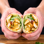 Crispy chicken wraps filled with shredded chicken, melted mozzarella and creamy white sauce